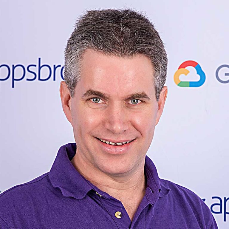Peter McShane at Appsbroker wearing purple branded polo