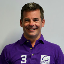 Mike Conner wearing a purple Appsbroker shirt, smiling at the camera