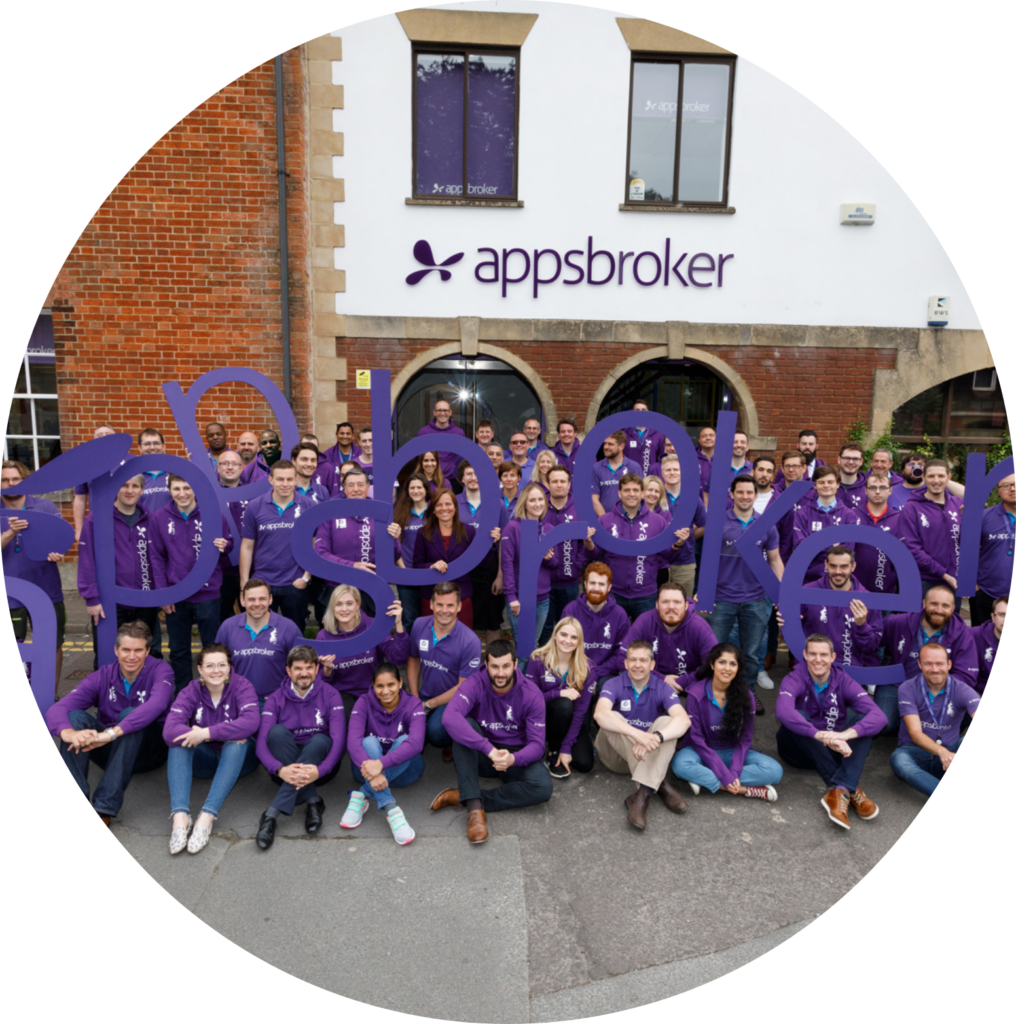 Appsbroker team holding sign outside the Swindon office