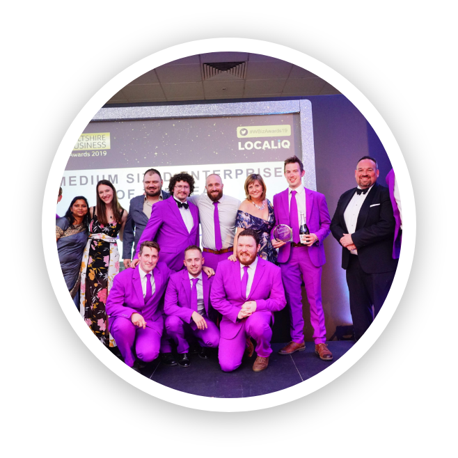 Appsbroker team wearing purple suits at the Wiltshire Business Awards