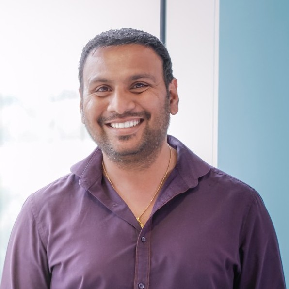 Krishna Vuduthalapalli at Appsbroker wearing purple shirt