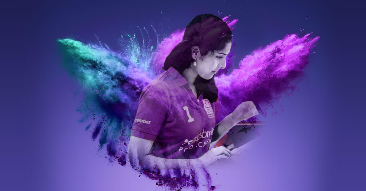 Shylaja Nandilath at Appsbroker wearing purple polo featuring colour explosion banner